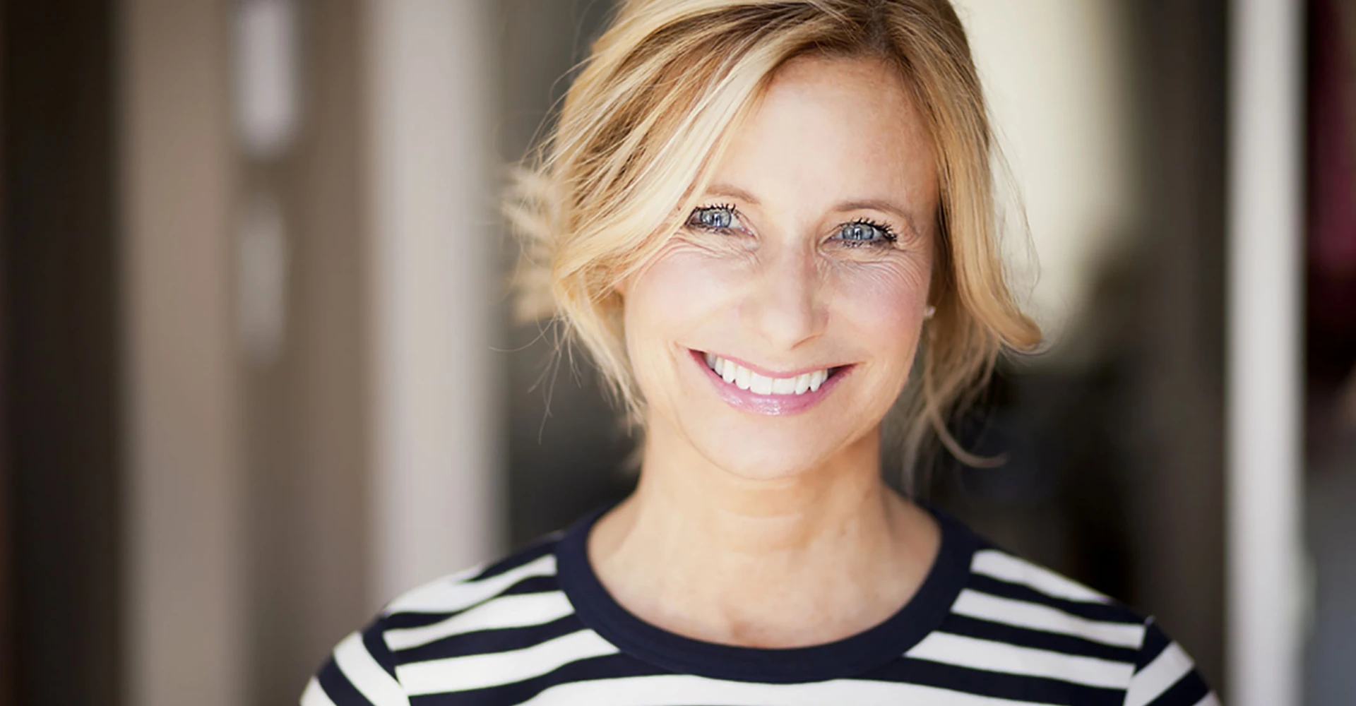 Woman smiling after getting cosmetic dentistry in Gainesville, FL